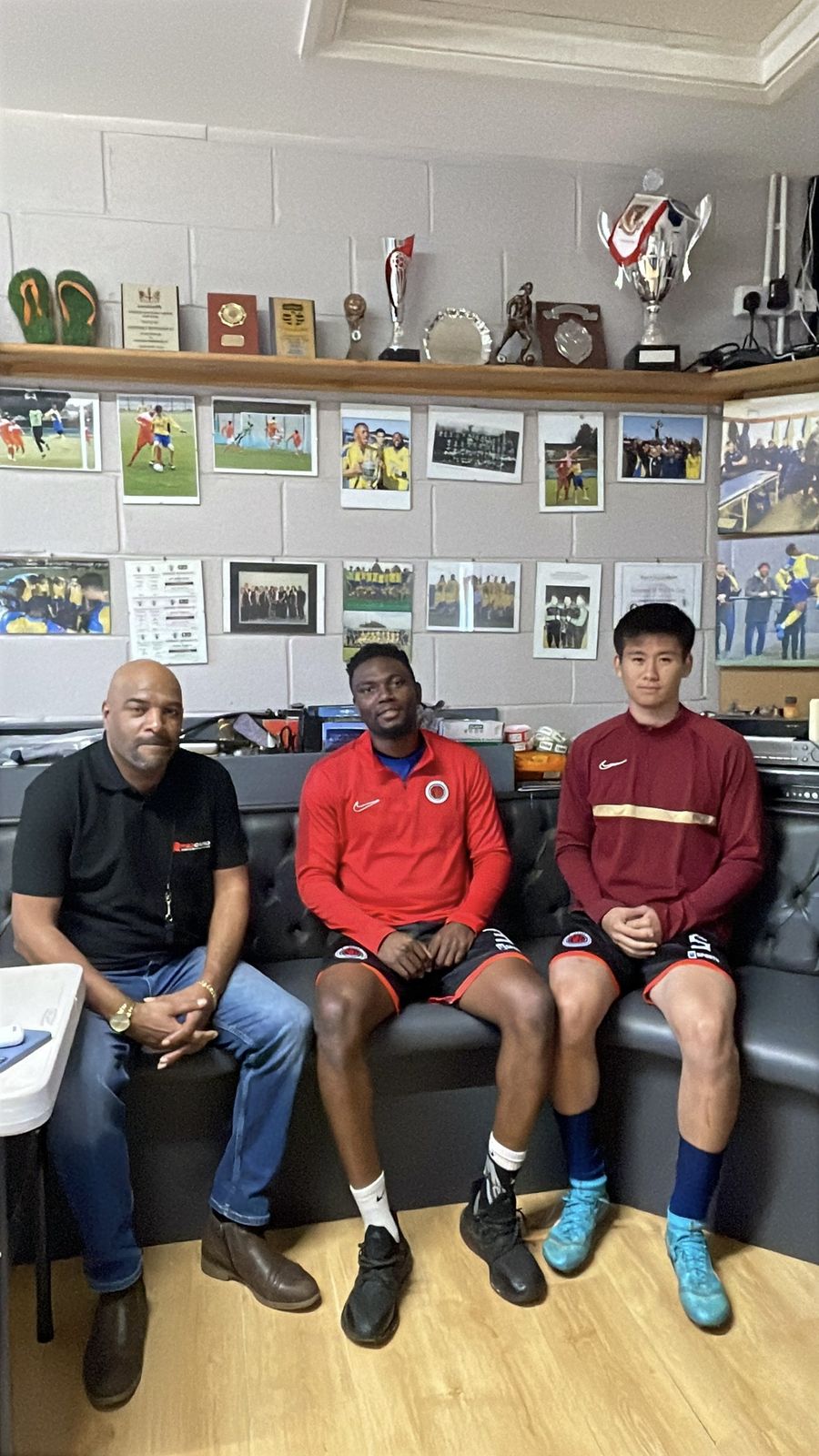 Red Card representative with NW London FC players in the boardroom